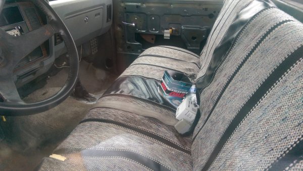 The pitiful interior of that '83, has the door panels but their behind the seats.