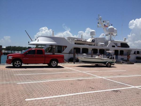 truck and boat with work in the background