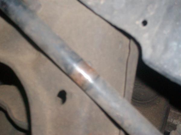 Upper a-arm rubbing steering shaft.
