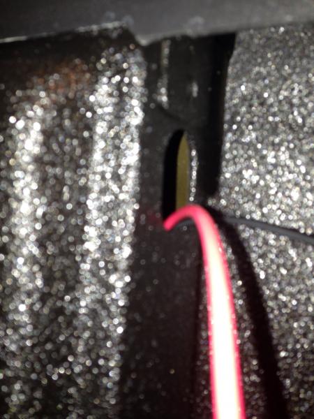 Utilized the hole in the back bed pillar to run power and ground wires under the bed